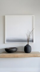 A modern Zen-inspired home with a white frame above a floating wooden shelf.