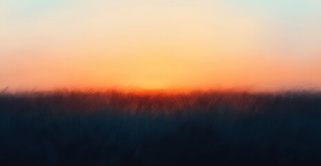 Obraz premium Blurred sunset over a field of tall grass.