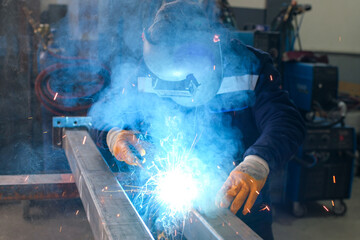 High-precision metal machining and welding process in an industrial workshop, including lathe turning, threading, milling, cutting, coolant application, gas control, and MIG welding operations.