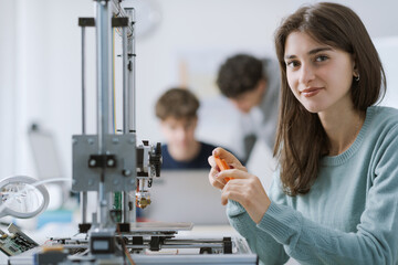 Portrait of a happy female student in the lab