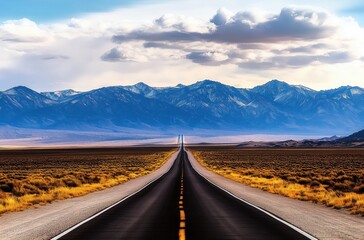 Endless Desert Highway Stretching Towards Majestic Mountains Under Dramatic Sky

