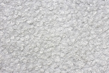 Wool surface blanket carpet photographed in close-up in white sheep color feel the material texture