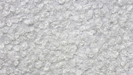 Wool surface blanket carpet photographed in close-up in white sheep color feel the material texture
