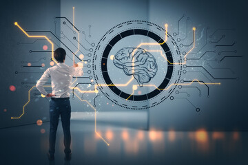 Businessman interacting with digital brain and circuit board interface.