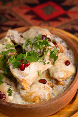 Georgian dish, Shkmeruli, chicken baked in sour cream sauce with garlic
