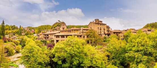 The enchanting village of Rupit i Pruit, near Piscines Municipals, Spain, boasts rustic stone...