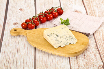 Blue cheese with mold over board
