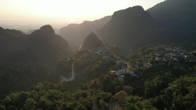Aerial view from drone of the rural village in the mountains before sunrise
