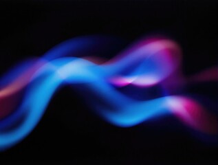 Fototapeta premium Abstract neon wave of blue and pink light flows and pulses with grain texture overlay against a dark background