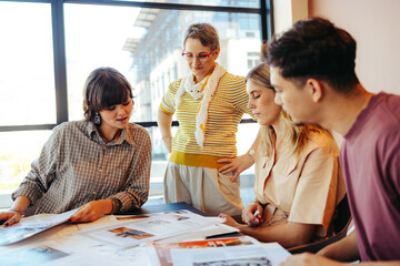 Teacher engaging with students during a collaborative study session in a modern classroom...