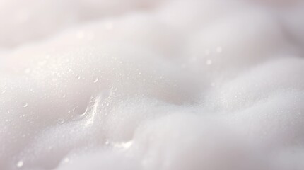 Close-up of white creamy foam texture for beauty products and skincare applications