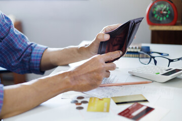 stressed asian man hand open empty wallet not have money to pay, not able payment bill or expense...