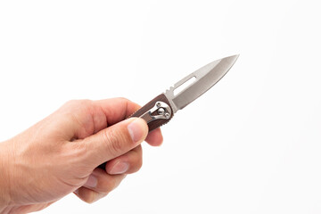 ナイフを持つ男性の手