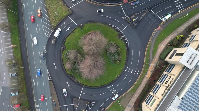 view from above of a traffic roundabout at rush hour. Located in Huddersfield in West Yorkshire