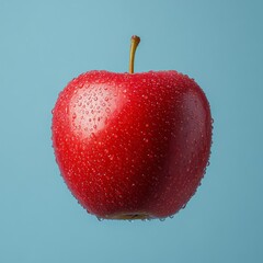 Juicy Red Apple with Water Droplets on Blue Background