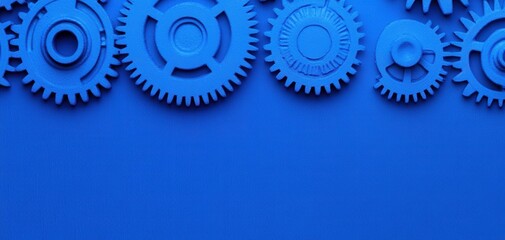 The interaction of gears in a mechanical system highlights the essence of engineering design, where efficiency and collaboration drive industrial innovation. A vibrant blue background featuring