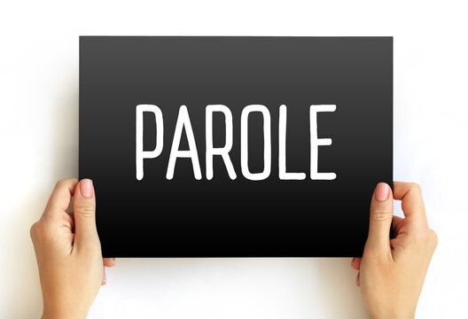 Parole - conditional release of prisoners before they complete their sentence, text concept on card