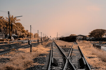 Infrared photography, a railway track extending into the distance. The tracks branch off in...