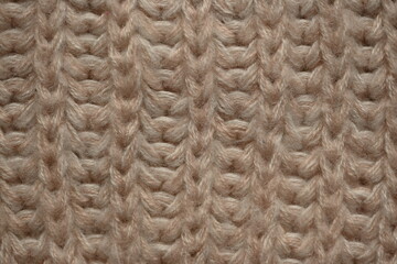 brown wool texture of acrylic knitted fabric, texture of knitted light brown sweater, close-up texture of beige knitted fabric, macro texture of tan knitted woolen clothes	
