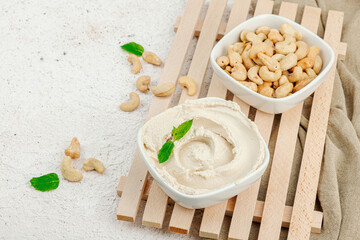 Homemade vegan cashew cheese. Raw healthy sauce in a bowl, lactose free food. Bio organic product