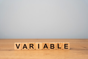Wooden blocks with the word variable. Variability, variation, flexibility and change in business concept.