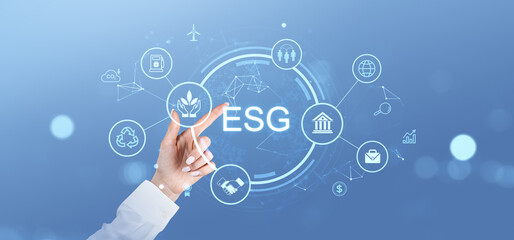 ESG concept with hand pointing at sustainability icons on a digital interface.
