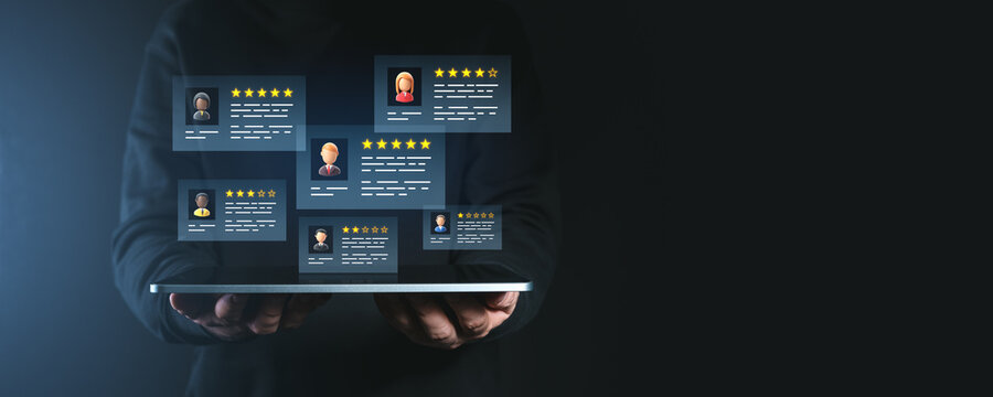 Digital customer feedback with star ratings displayed on a tablet screen held by a person.