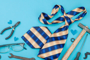 Happy Fathers Day concept. Set of manual tools, tie, spare parts, traditional symbols
