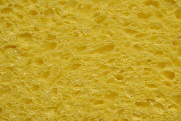 yellow sponge texture close up, yellow abstract sponge texture as background photo on top 