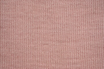 texture of knitted pastel pink sweater, close-up texture of beige pink knitted fabric, macro texture of tan knitted woolen clothes