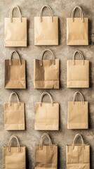 Fototapeta premium Biodegradable Paper Shopping Bags Arranged in Grid on Clean Surface