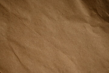light brown crumpled paper texture as background, old kraft paper as background, crumpled packing material texture as background photo above