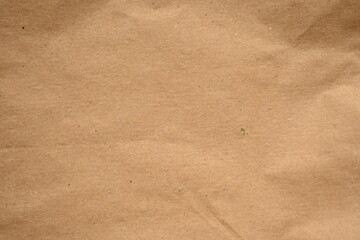 light brown crumpled paper texture as background, old kraft paper as background, crumpled packing material texture as background photo above