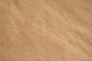 light brown crumpled paper texture as background, old kraft paper as background, crumpled packing material texture as background photo above