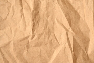 light brown crumpled paper texture as background, old kraft paper as background, crumpled packing material texture as background photo above