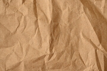 old kraft paper as background, crumpled packing material texture as background photo above, light brown crumpled paper texture as background, 