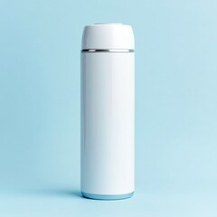 White insulated bottle on blue background, studio shot