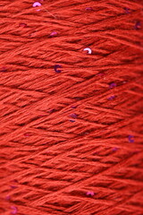 texture of red yarn threads. Soft textile background for design, fashion, craft, or handmade business. Ideal for knitting stores, textile production, branding materials, or as a fabric texture in crea