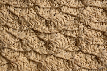 macro texture of light brown paper hat as background, close up texture of panama hat, paper for panama hat	