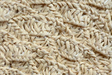 macro texture of light brown paper hat as background, close up texture of panama hat, paper for panama hat	
