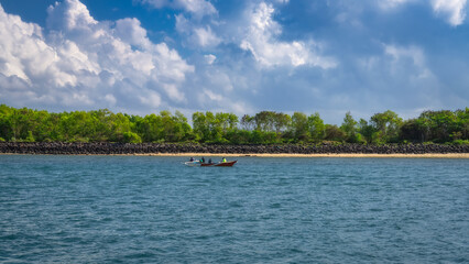 A vibrant coastal scene features colorful mangroves, fishing boat on clear waters, and a bright sky, making it an ideal place for nature lovers and outdoor enthusiasts, Bali, Indonesia