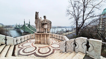 Stone statue of King Saint Steven outside the Gellert Hill Cave in front of the Liberty Bridge. Gellert Hill, Budapest, Hungary, Europe.