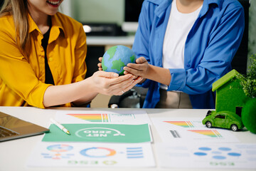 Business team people planning hand using laptop for working technology and business Net zero