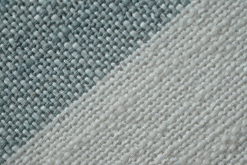 Striped fabric texture with beige, red, and gray colors. Textile background with woven pattern for fashion, design, and home decor projects. Natural cotton material close-up.