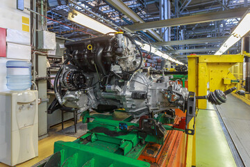 A passenger car engine ready for assembly on a conveyor.