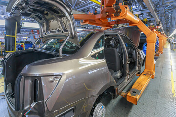 Fototapeta premium Conveyor assembly line of a passenger car.