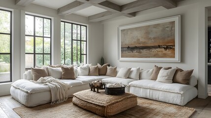 A neutral-toned modern interior with a white frame symmetrically placed above a cozy white couch.