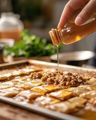 Drizzling Honey Over Freshly Baked Traditional Baklava Dessert