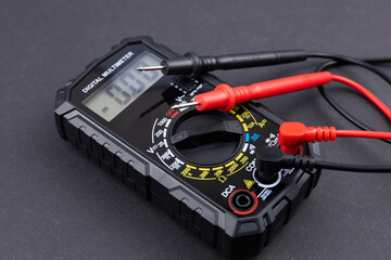 Digital multimeter on dark background
