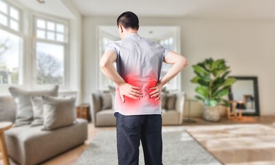 Kidney carcinoma : Agonizing Kidney Pain, Young Man Clutching His Lower Back in Nature, Close-Up...